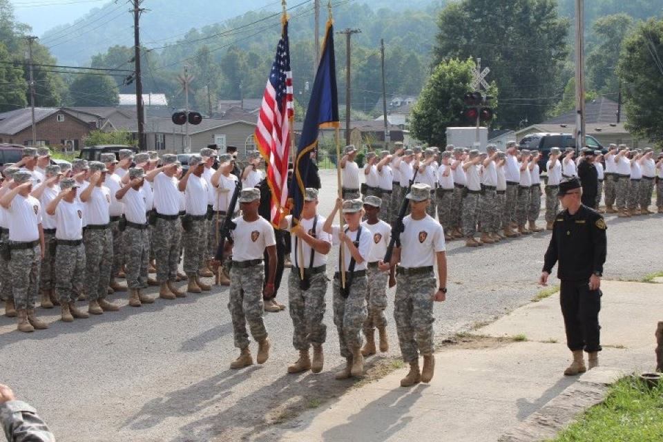 Cadets marching with the U.S. flag